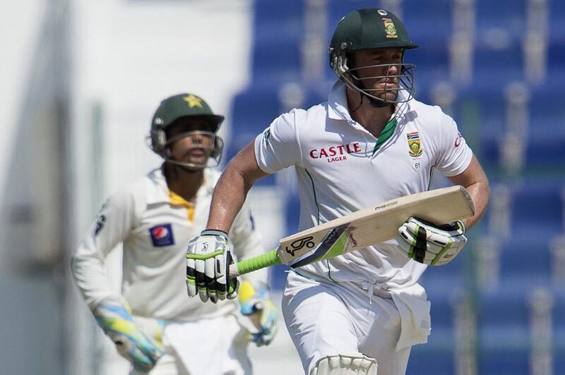 AB de Villiers, right, had innings of 19 and 90 with the bat in the first Test against Pakistan. AFP Photo