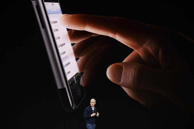 Tim Cook, chief executive officer of Apple Inc., speaks about the iPhone during an event at the Steve Jobs Theater in Cupertino, California. David Paul Morris / Bloomberg