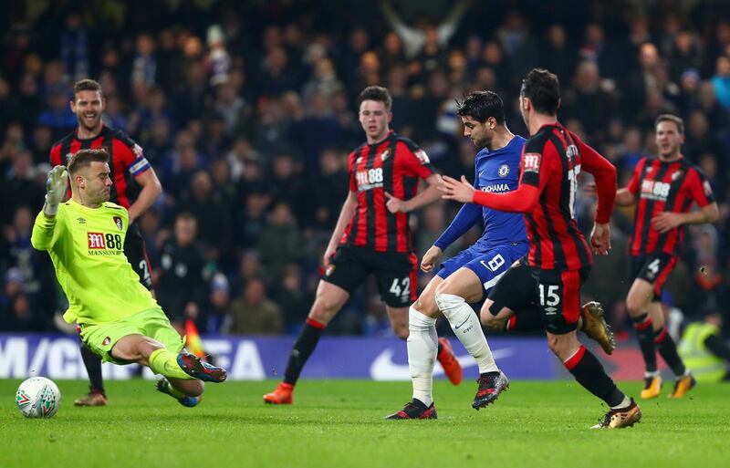 Chelsea's Alvaro Morata shoots the ball under Bournemouth goalkeeper Artur Boruc to give his side an injury time winner. Clive Rose / Getty Images