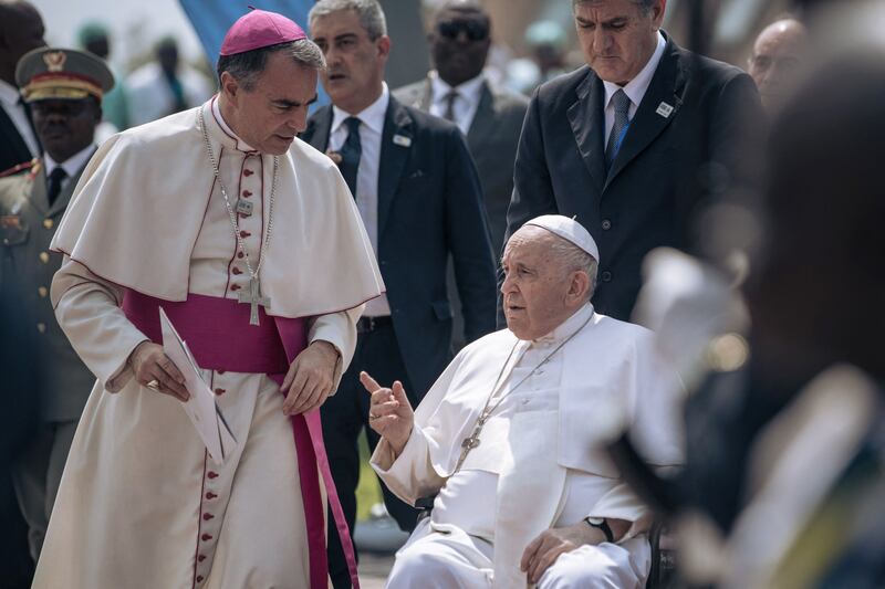 Pope Francis is escorted to the plane when leaving Kinshasa in the Democratic Republic of Congo. AFP