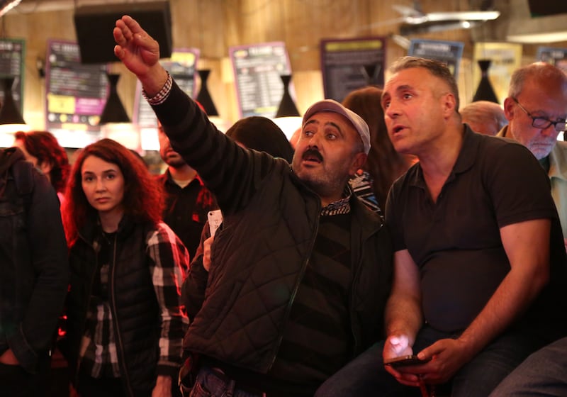 Turkish expats watch the election results come in on a big screen in Berlin. Getty