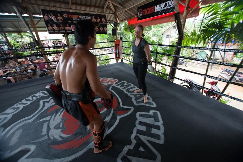 Laura Koot trains P-Noog at Tiger Muay Thai in Phuket, Thailand, Saturday, Jun. 15, 2013. (Photo by Mitch Viquez ©2013)