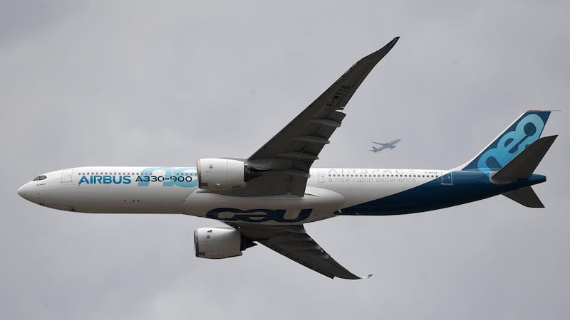 An Airbus A330-900 neo flies by during a display flight presentation. EPA