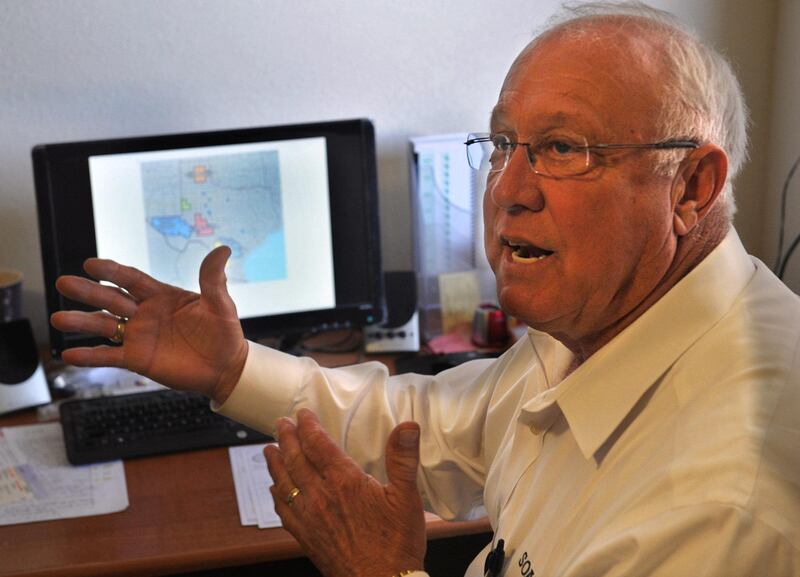 FILE - In this March 19, 2014 file photo, Gary Walker, project manager for Seeding Operations & Atmospheric Research (SOAR), talks about analyzing data from the cloud seeding that was done Saturday March 15, 2014 near Wichita Falls, Texas. Wichita Falls is so far behind on rainfall that its leaders are asking state regulators for permission to use treated toilet flushes as drinking water.   (AP Photo/Wichita Falls Times Record News, Torin Halsey, File)