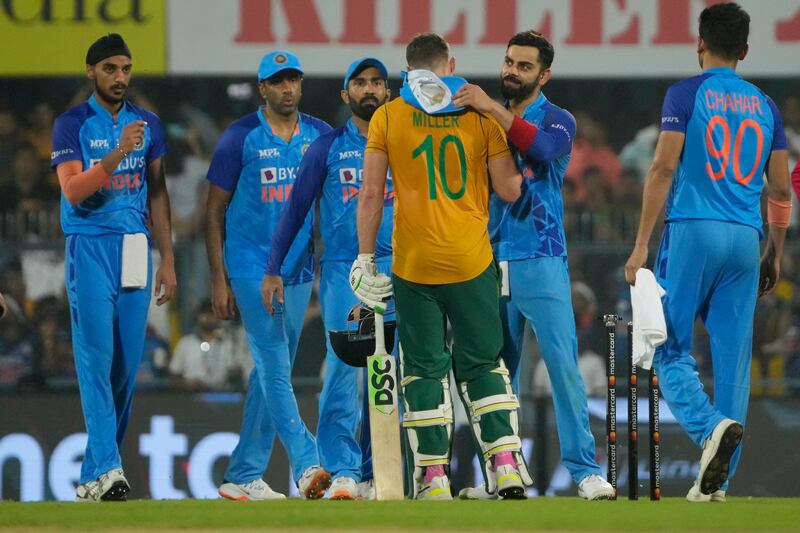 Virat Kohli, second right, congratulates centurion David Miller after India won the second T20. AP