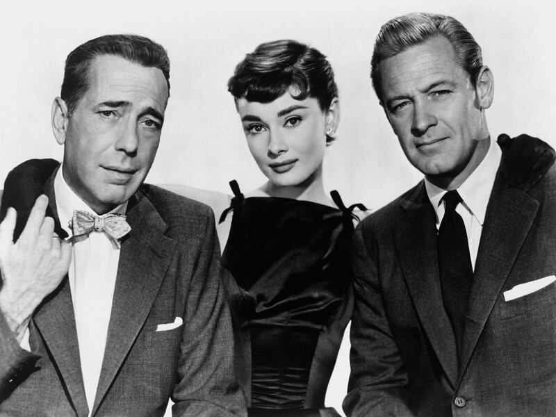 LOS ANGELES - 1954:  Actress Audrey Hepburn and actors Humphrey Bogart and William Holden pose for a publicity still for the Paramount Pictures film 'Sabrina' in 1954 in Los Angeles, California. (Photo by Donaldson Collection/Michael Ochs Archives/Getty Images)  