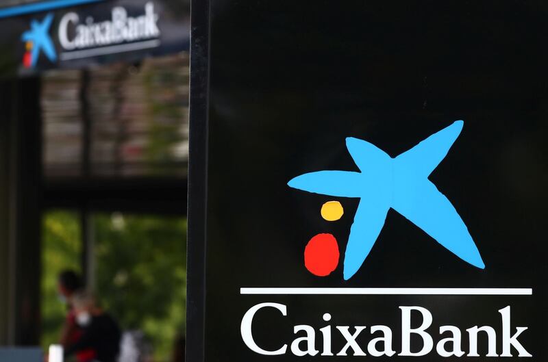 The logo of Caixabank is seen outside a branch in Madrid, Spain, September 16, 2020. REUTERS/Sergio Perez