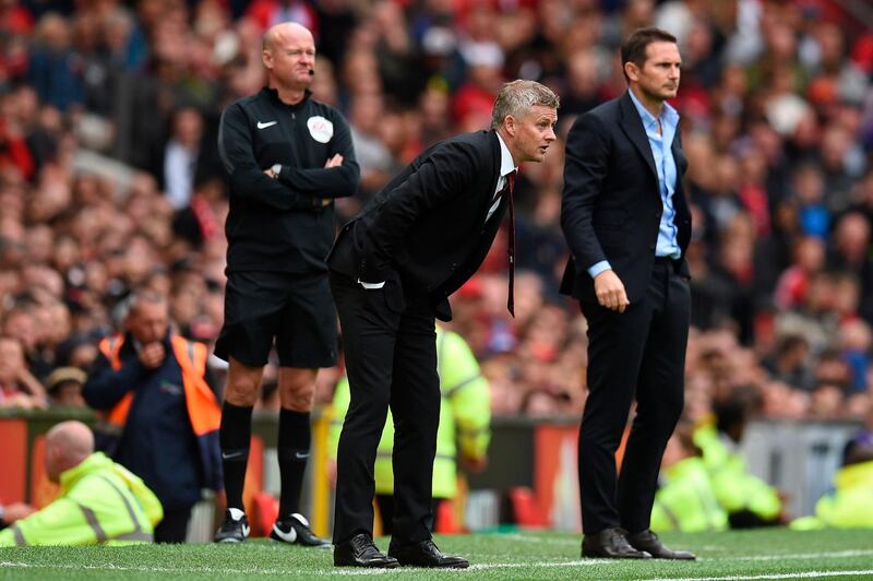 Manchester United's Norwegian manager Ole Gunnar Solskjaer and Chelsea's manager Frank Lampard watch on. AFP