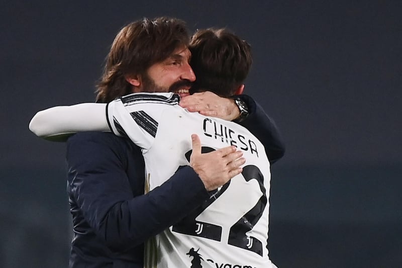 Juventus manager Andrea Pirlo celebrates with Federico Chiesa after the match. AFP