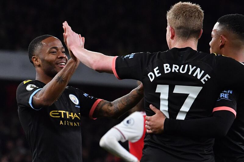 Raheem Sterling, left, celebrates with Kevin De Bruyne at the Emirates Stadium in London. AFP