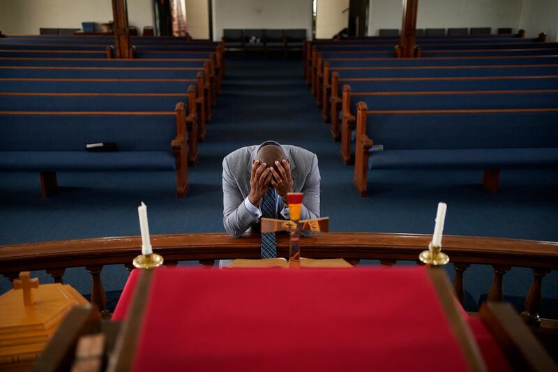 Robert Turner, pastor of the Vernon African Methodist Episcopal Church, Oklahoma, prays days before the Tulsa Race Massacre centennial.  AP Photo
