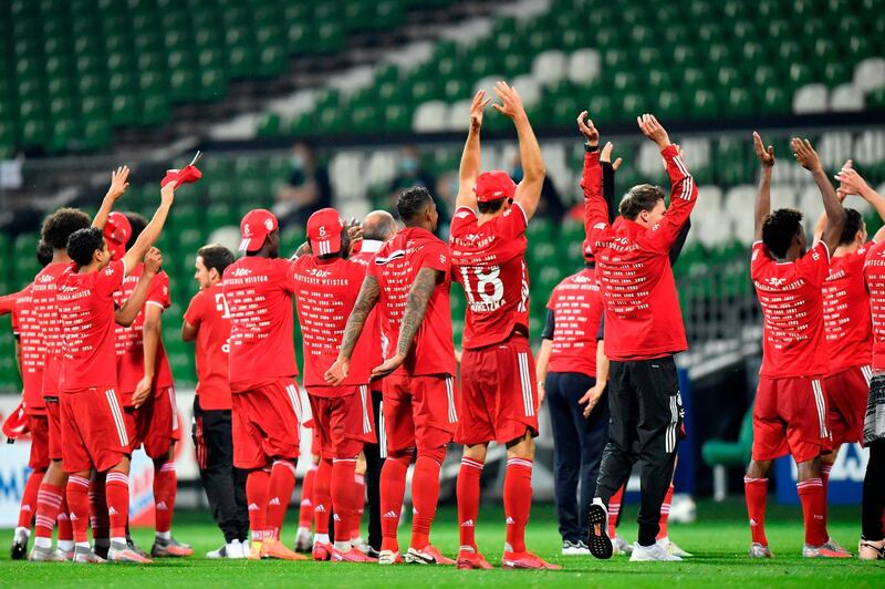 Bayern's players celebrate becoming Bundesliga champions for the eighth year in a row. AFP