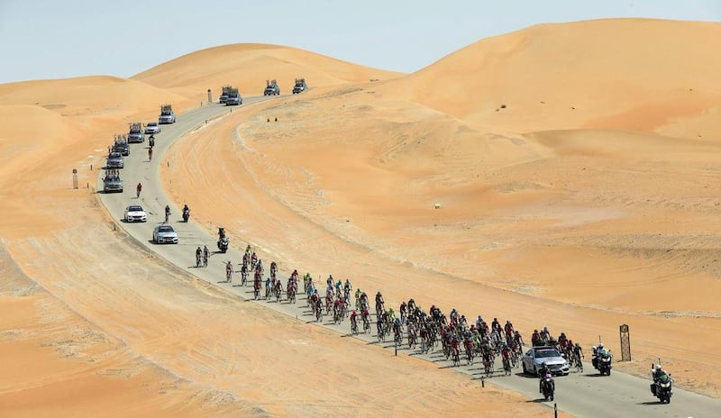The peloton ride through the desert on Thursday on the first day of the Abu Dhabi Tour. Claudio Peri / EPA