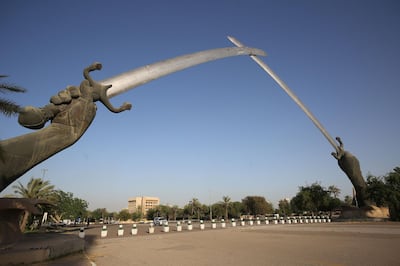 A picture taken on June 3, 2019 shows the Victory Arch known as the Swords of Qadisiyah in Baghdad's high-security Green Zone. The Green Zone, home to the Iraqi parliament and US embassy, will be opened to traffic around the clock from Tuesday, the government said. It has been heavily fortified since the US-led invasion that overthrew dictator Saddam Hussein in 2003, with nearly all Iraqis denied access to its 10 square kilometres. / AFP / AHMAD AL-RUBAYE
