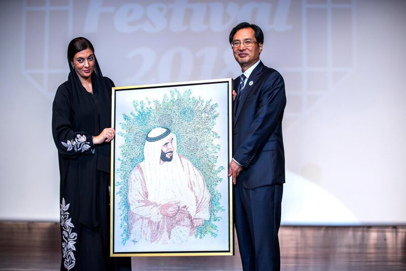 Abu Dhabi, U.A.E., October 17, 2018.  
First day of the Korea Festival. --  (L-R) Ruba Al Hassan, UAE Ministry of Culture and Knowledge Development and H.E. Park Kang-ho, Ambassador of the Republic of Korea to the UAE exchange tokens of appreciation.
Victor Besa / The National
Section:  IF
Reporter:  Evelyn Lau