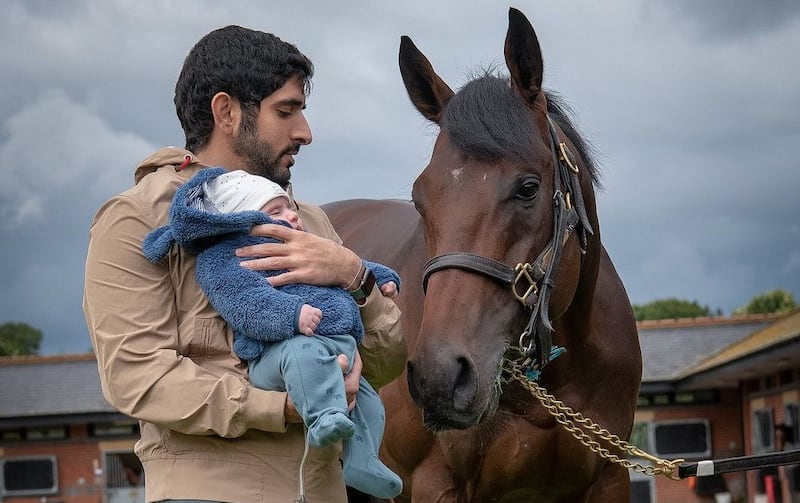 Sheikh Hamdan bin Mohammed with his son, Sheikh Rashid bin Hamdan, at the Godolphin stables in England. Photo: Instagram / Faz3