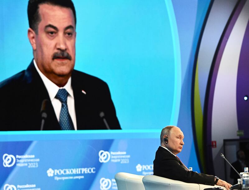 Iraqi Prime Minister Mohammed Shia Al Sudani speaks as Russian President Vladimir Putin listens at the 2023 Russian Energy Week forum in Moscow on October 11.  Kremlin.