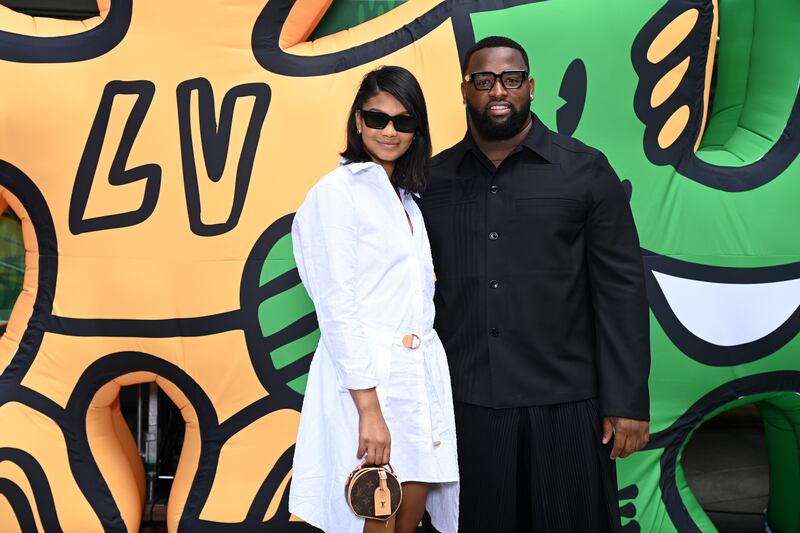 Model Chanel Iman and American footballer Davon Godchaux attend the Louis Vuitton show. Getty Images For Louis Vuitton