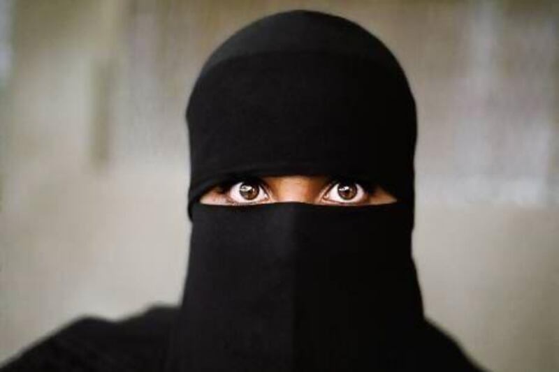 A woman wearing a burqa at a polling booth in Yemen, 1997. Courtesy Steve McCurry / The Empty Quarter
