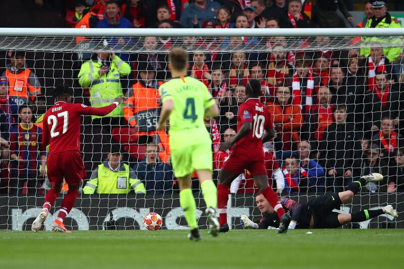 LIVERPOOL, ENGLAND - MAY 07:  Divock Origi (27) scores his team's first goal during the UEFA Champions League Semi Final second leg match between Liverpool and Barcelona at Anfield on May 07, 2019 in Liverpool, England. (Photo by Clive Brunskill/Getty Images)
