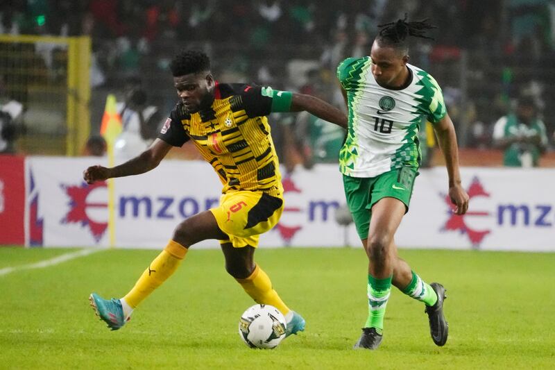 Ghana's Thomas Partey and Joe Aribo of Nigeria battle for the ball. AP