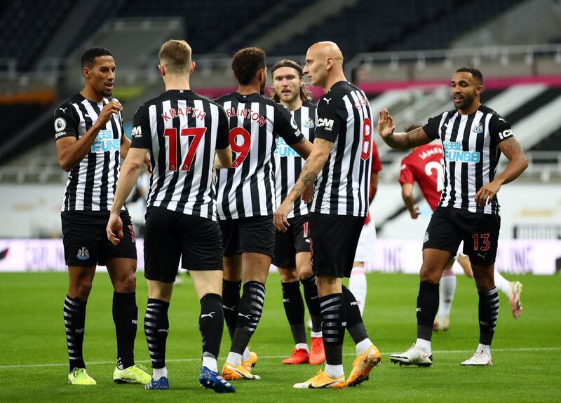 Newcastle players celebrate taking the lead. AFP