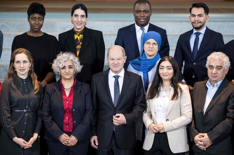 German Chancellor Olaf Scholz, centre, and his integration chief Reem Alabali-Radovan, second right, met minority and migrant leaders at the chancellery in Berlin. AFP