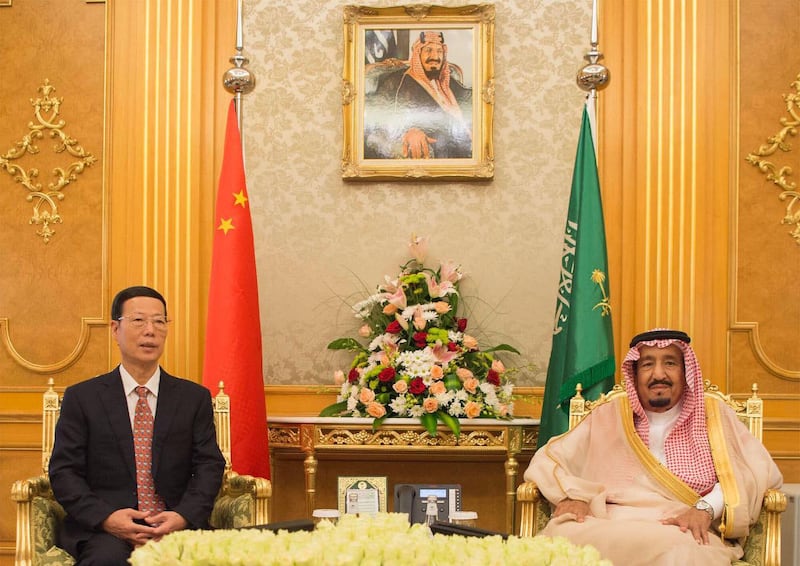 A handout picture by the Saudi Royal Palace on August 24, 2017 shows Saudi's King Salman (R) meeting with the First Vice-Premier of China Zhang Gaoli in Jeddah. WAM