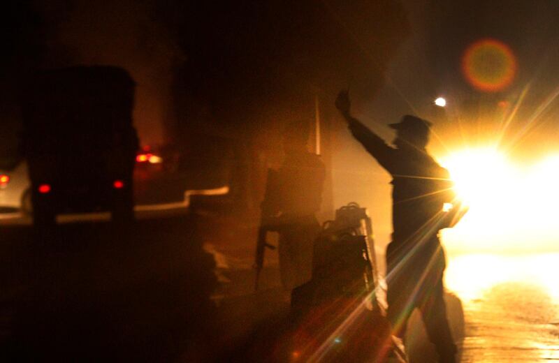 epaselect epa07247636 Afghan security officials inspect the scene of a suicide car bomb attack in Kabul, Afghanistan, 24 December 2018. A group of insurgents attacked an Afghan government building in Kabul on 24 December. There was no immediate word on casualties in the attack on the complex that houses the Ministry for Labour,Social Affairs, Martyrs, and Disabled.  EPA/HEDAYATULLAH AMID