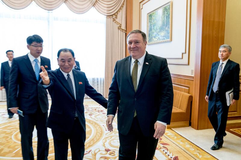 U.S. Secretary of State Mike Pompeo, center right, and Kim Yong Chol, center left, a North Korean senior ruling party official and former intelligence chief, arrive for a lunch at the Park Hwa Guest House in Pyongyang, North Korea, Saturday, July 7, 2018. Also pictured is U.S. Ambassador to the Philippines Sung Kim, right. (AP Photo/Andrew Harnik, Pool)