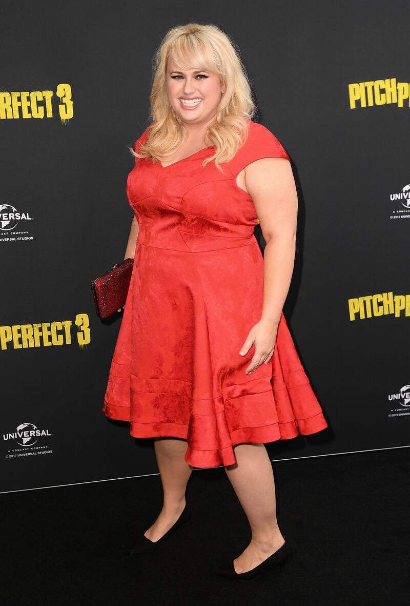 Rebel Wilson, in a red cap sleeved prom dress, attends the 'Pitch Perfect 3' premiere in Sydney on November 29, 2017. EPA