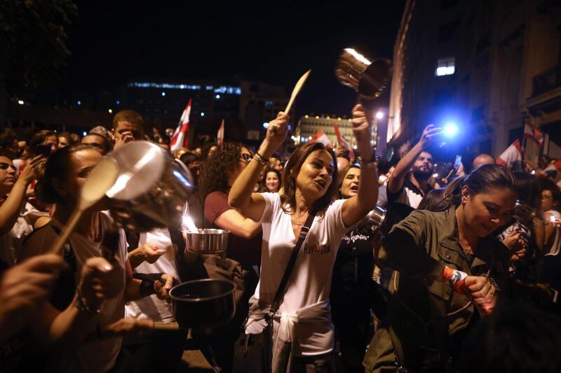 Lebanese protesters bang on pots and pans during an anti-government demonstration in the capital Beirut.  AFP