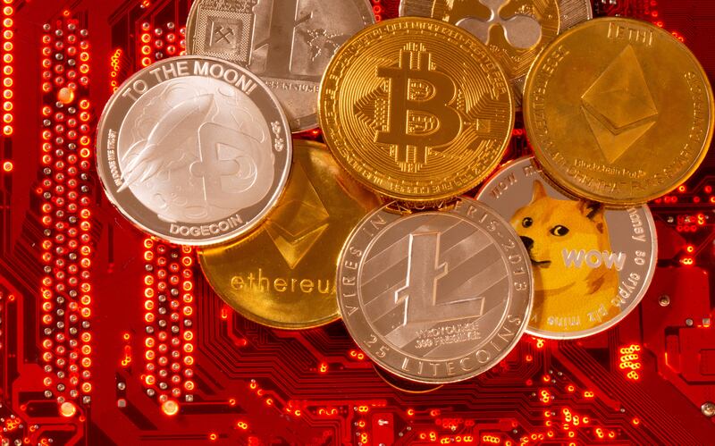 Representations of cryptocurrencies Bitcoin, Ethereum, DogeCoin, Ripple, Litecoin placed on a PC motherboard. Dado Ruvic / Reuters