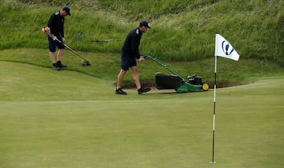 Golf - The 146th Open Championship - Royal Birkdale - Southport, Britain - July 19, 2017   Greenkeepers cut the grass during a practice round   REUTERS/Paul Childs