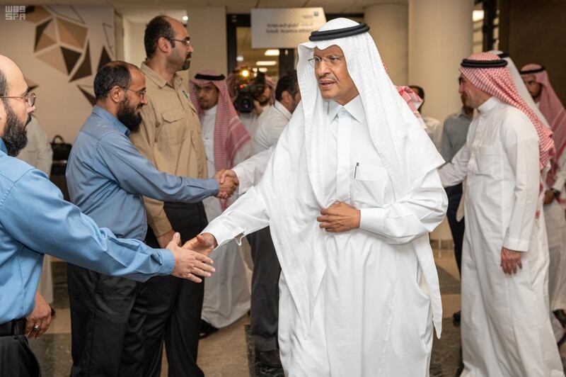 Saudi Energy minister Prince Abdulaziz bin Salman shakes hands with staff during his visit to an Aramco oil facility one day after the attacks in Abqaiq, Saudi Arabia September 15, 2019. Picture taken September 15, 2019. Saudi Press Agency/Handout via REUTERS ATTENTION EDITORS - THIS PICTURE WAS PROVIDED BY A THIRD PARTY.