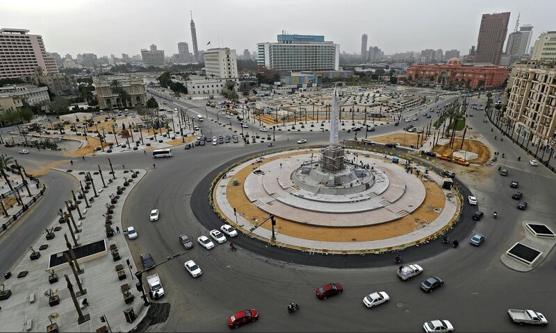 the Egyptian capital Cairo's Tahrir square with very little traffic on March 25, 2020, on the first day of a two-weeks night-time curfew to contain the spread of the novel coronavirus. (Photo by Khaled DESOUKI / AFP)