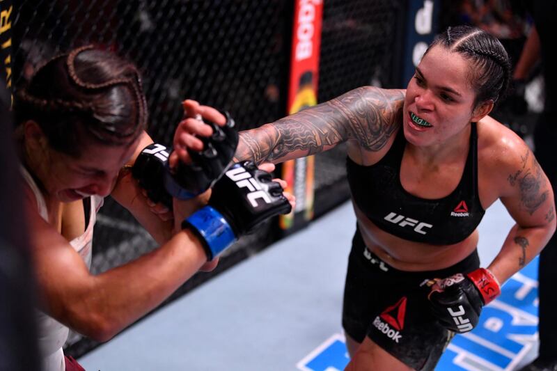 Amanda Nunes punches Felicia Spencer in their UFC featherweight championship bout during UFC 250 at the UFC APEX. Reuters