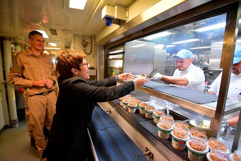 German Defence Minister Annegret Kramp-Karrenbauer gets a meal on board of a military corvette during her two-day-visit of the German soldiers of the United Nations Interim Force in Lebanon (UNIFIL) as they leave the Port of Limassol, Cyprus. AFP