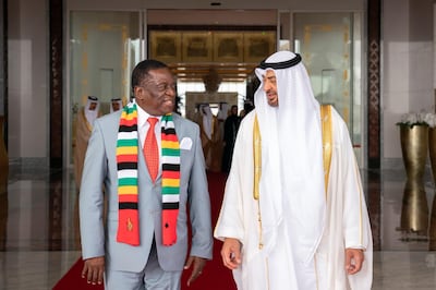 ABU DHABI, UNITED ARAB EMIRATES - March 16, 2019: HH Sheikh Mohamed bin Zayed Al Nahyan Crown Prince of Abu Dhabi Deputy Supreme Commander of the UAE Armed Forces (R), receives HE Emmerson Mnangagwa, President of Zimbabwe (L), at the Presidential Airport. 

( Ryan Carter for the Ministry of Presidential Affairs )
---
