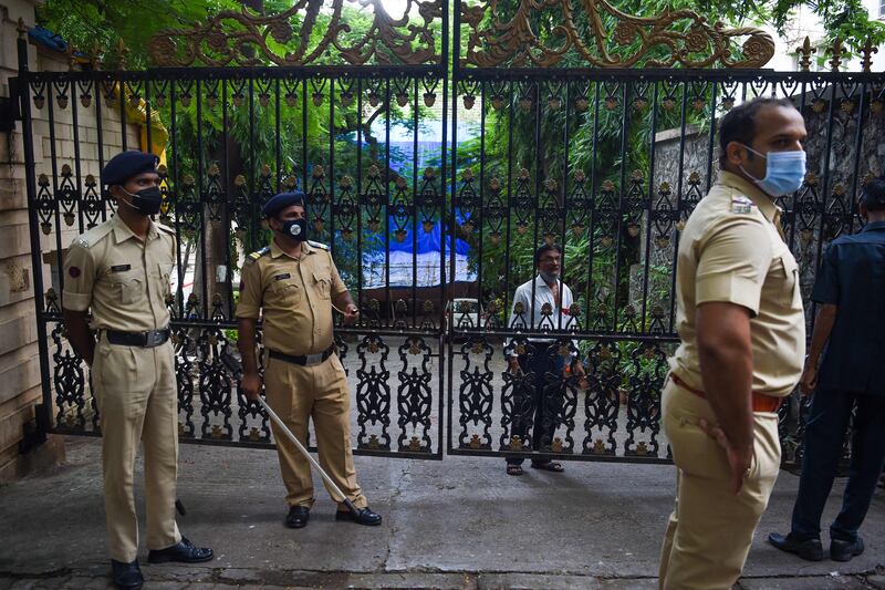 Police stand guard outside Dilip Kumar's house after he his death was announced on Wednesday.