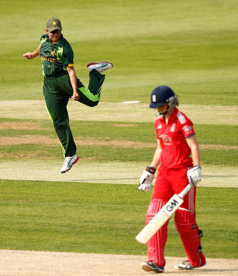 Cricket - England v Pakistan - Second NatWest Womens International T20 - Loughborough University - 5/7/13 
Pakistan's Sana Mir (L) celebrates after catching out England's Amy Jones off of the bowling of Sadia Yousuf (not pictured) 
Mandatory Credit: Action Images / Andrew Boyers 
Livepic