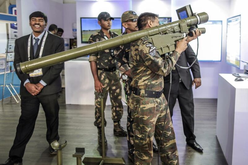 A military professional tries out a Zen Technologies anti-aircraft air defence simulator during a defence exhibition. The company plans to increase its exports business. Dhiraj Singh / Bloomberg