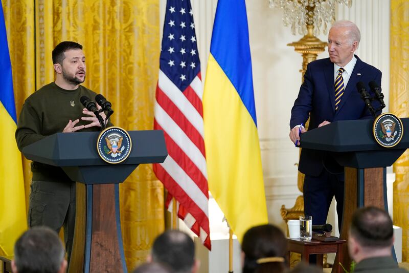 Mr Biden listens as Mr Zelenskyy speaks. AP