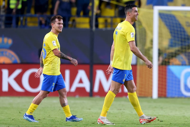 Otavio and Cristiano Ronaldo during the Asian Champions League match between Al Nassr and Al Duhail. AFP