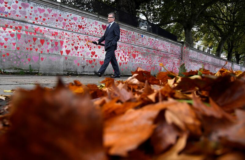 The National Covid Memorial Wall in London. Under UK Prime Minister Boris Johnson’s winter plan announced in September, Plan B would include a return to working from home for many, mandatory mask-wearing in some settings and vaccine certificates required at large indoor gatherings. Reuters