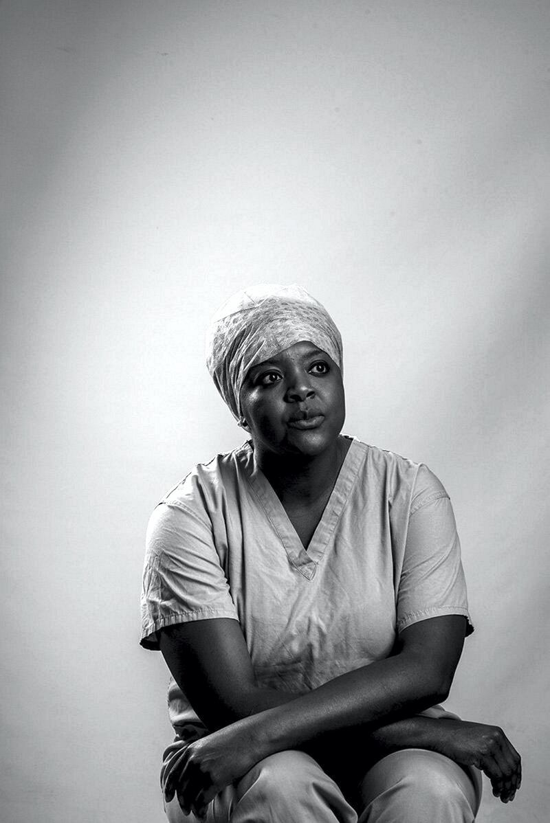 This is a studio portrait of Tendai, a recovery and anaesthetics nurse, who was born in Zimbabwe, and now lives in my local town - Reading, Berkshire. I wanted to portray her caring side as well as a look of concern and uncertainty that many of us have experienced during this pandemic. It’s why I chose a lower than normal angle and asked her to look off camera, placing her half way down in the frame by NEIL PALMER
