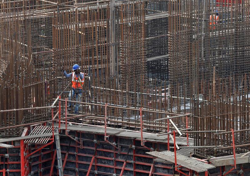 A man works on a construction site of a residential building in Mumbai, India, October 31, 2016. REUTERS/Shailesh Andrade - S1BEUKDQFHAA