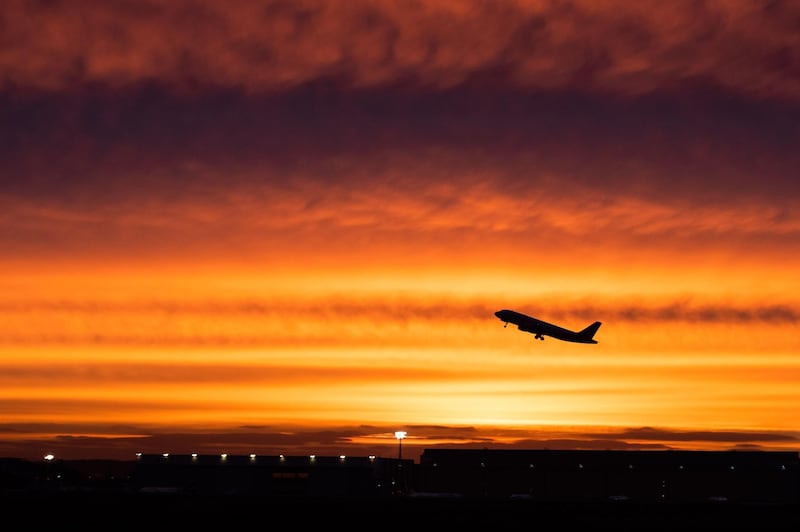 An aircraft takes off at sunrise at Duesselorf airport on January 10, 2019. Almost 640 flights were cancelled in Germany January 10, 2019 as security staff went on strike at three airports, Duesseldorf, Cologne-Bonn and Stuttgart, meaning disruption for around 100,000 passengers.   - Germany OUT
 / AFP / dpa / Marcel Kusch
