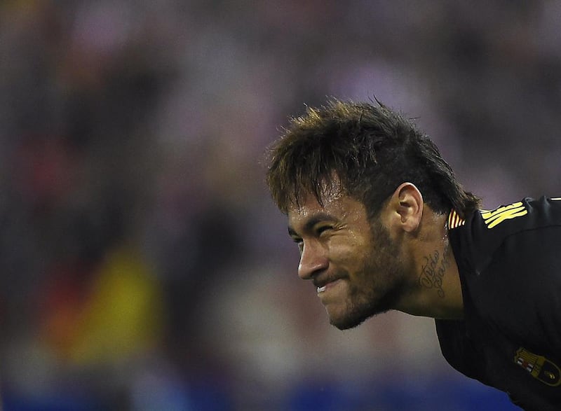 FC Barcelona forward Neymar reacts during this side's Champions League loss to Atletico Madrid on Wednesday. Pierre-Philippe Marcou / AFP / April 9, 2014