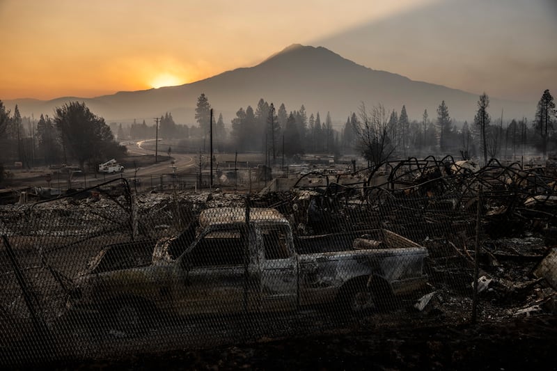 The charred wreckage after a wildfire in Weed, California. AP